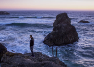 2018-01-01 15_37_04-Man in Black Shirt Standing on Rock in Between Sea Water · Free Stock Photo